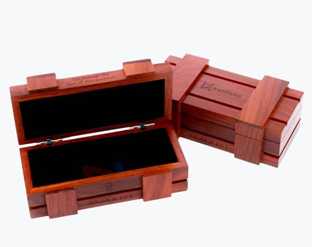 Opened rosewood wooden storage shaped as a chest for eyeglasses by NURILENS.