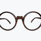 Round wooden glasses made of ebony with subtle black wood grain by NURILENS.