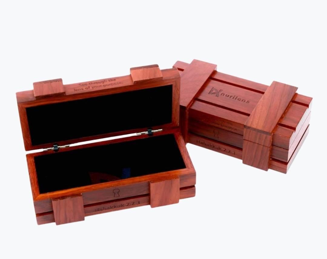 Opened rosewood wooden storage shaped as a chest for eyeglasses by NURILENS.