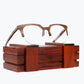 Brown browline glasses made of Kevazingo and metal sitting on rosewood wooden case by NURILENS