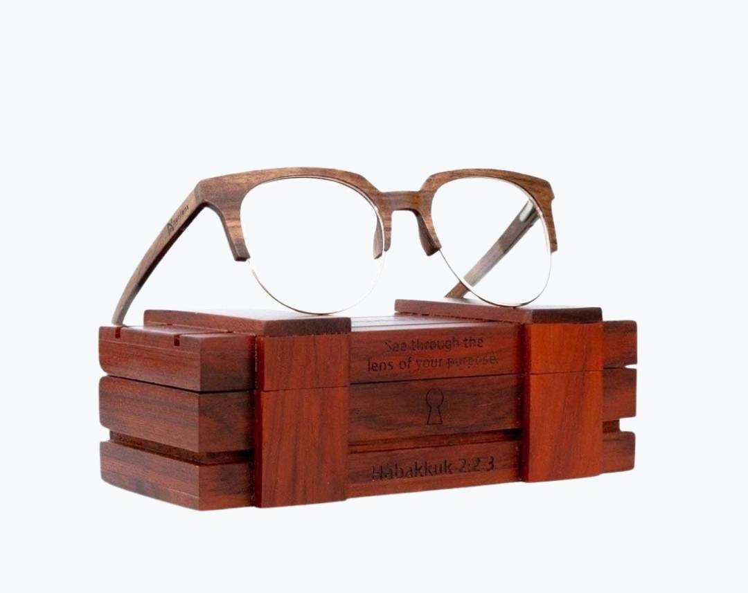 Brown browline glasses made of Kevazingo and metal sitting on rosewood wooden case by NURILENS