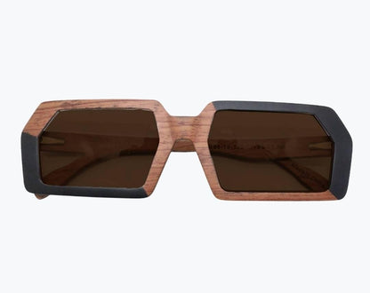 Folded brown and black rectangular wooden sunglasses with brown lenses made of black birch and brown kevazingo wood by NURILENS.