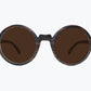 Round brown wooden sunglasses made of ebony with subtle black wood grain with brown lenses by NURILENS.