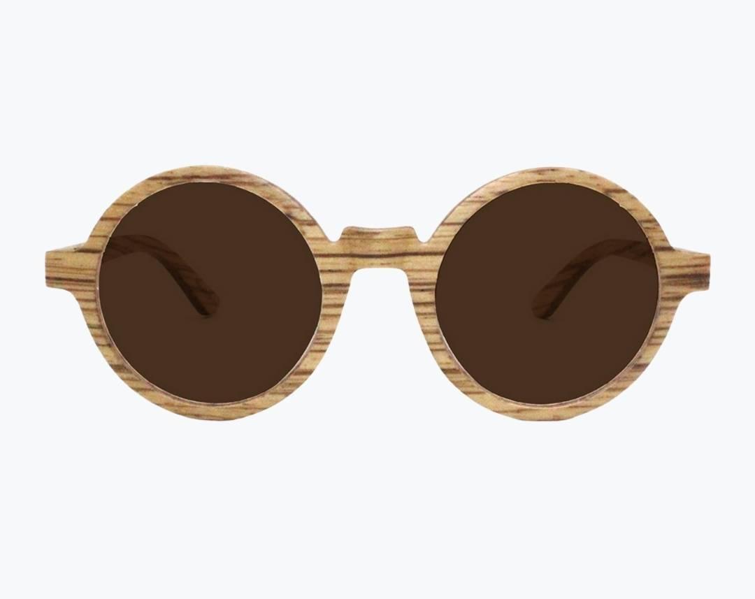 Round wooden sunglasses made of light brown Zebrawood with subtle black stripes with brown lenses by NURILENS.