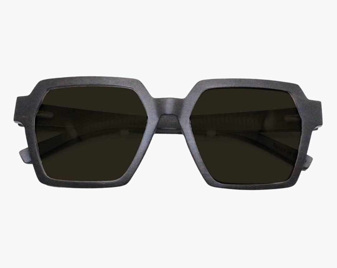 Folded pair dark brown wayframe sunglasses made of ebony with subtle black wood grain with dark gray lenses by NURILENS.
